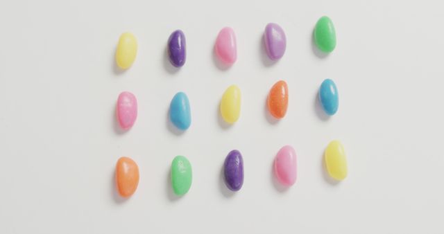 Colorful Jelly Beans Arranged in Grid Pattern on White Background - Download Free Stock Images Pikwizard.com