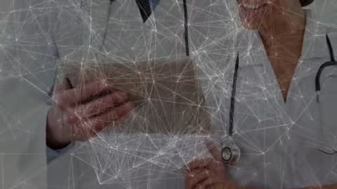 Doctors Embracing Technology and Teamwork in Medical Setting