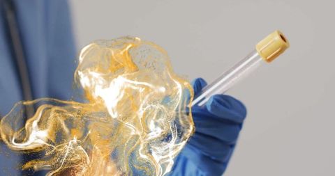 Innovative Research with Golden Energy Swirling Around Test Tube