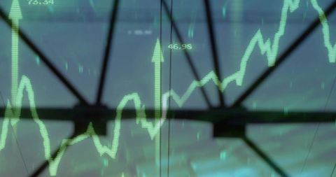 Green Digital Stock Chart Overlaying Glass Panels and Steel Truss Showing Market Growth