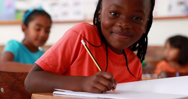 Smiling African American Girl Learning in Class - Download Free Stock Images Pikwizard.com