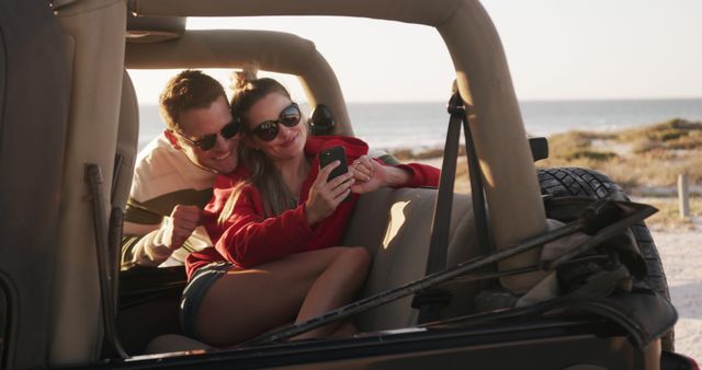 Couple Riding in Convertible Taking Selfie on Beach Vacation - Download Free Stock Images Pikwizard.com