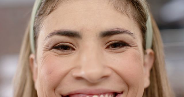 Close-Up of Smiling Woman with Headband - Download Free Stock Images Pikwizard.com