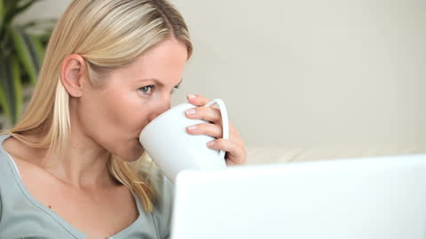 Woman Engaged in Working from Home with Coffee