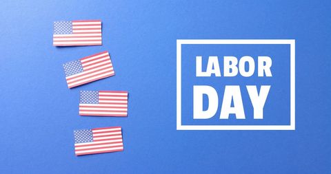 Labor Day Celebration with USA Flags on Blue Background