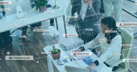 Businesswomen Analyzing Data in Modern Corporate Office Environment