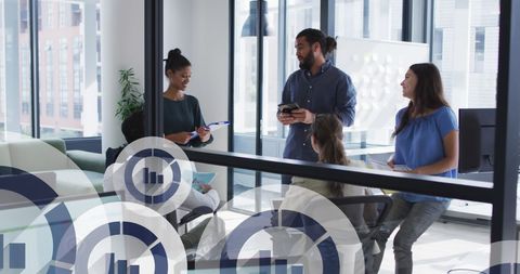 Diverse Team Collaborating with Digital Icons in Modern Office