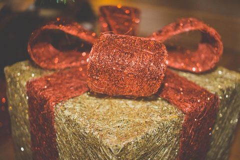 Festive Gift Box Wrapped in Red and Gold Glitter