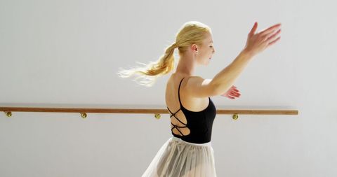 Graceful Ballerina in Elegant Studio Dance Pose with Copy Space - Download Free Stock Images Pikwizard.com