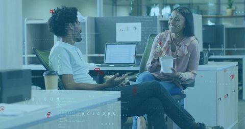 Colleagues Sharing Lunch in Modern Workspace