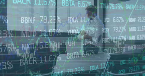 Business Analysts Reviewing Stock Market Data in Modern Office