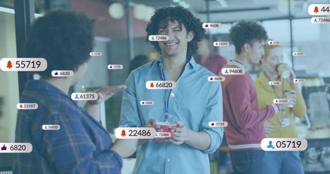 Smiling man holding bowl chatting in modern office with augmented reality social badges