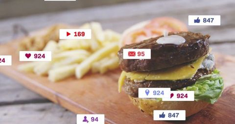 Double Cheeseburger with Social Engagement Icons in Rustic Setting