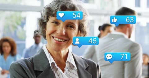 Senior Businesswoman Engaging with Tasks Social Media in Modern Office