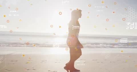 Couple walking on beach with technological overlay for digital connection