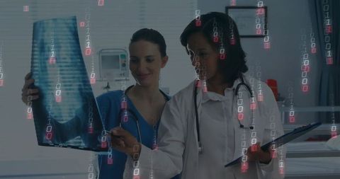 Doctors Analyzing X-ray with Digital Binary Overlay in Clinic