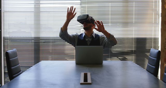 Businessman using a VR headset in an office setting. Perfect for illustrating modern workplace technology, remote work possibilities, innovative business practices, and tech-savvy environments.
