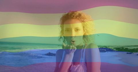 Woman on Beach Blowing Kisses Under Pastel Rainbow Overlay