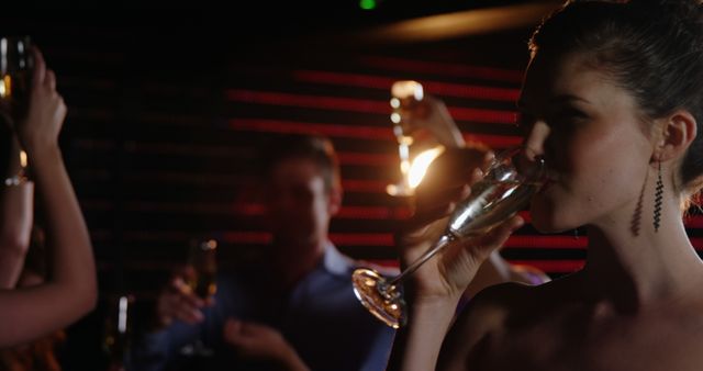 Beautiful woman drinking champagne in bar 4k