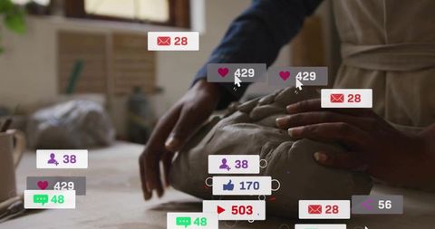 Shaping wet clay by hand in pottery studio with floating social media notifications