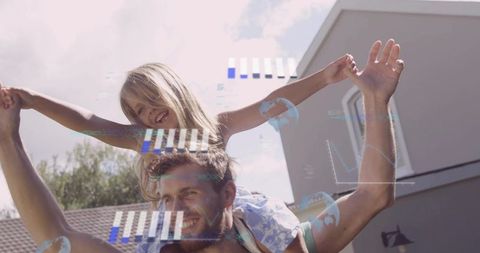 Father carrying daughter on shoulders in sunny backyard with floating digital overlays