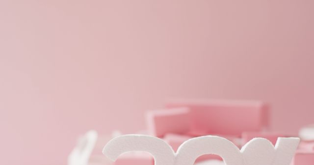 Perfect for use in Valentine's Day promotions, romantic greeting cards, love letters, or wedding invitations. The soft pink background and white letters evoke feelings of tenderness and affection, making it ideal for any romantic or celebration-themed context.