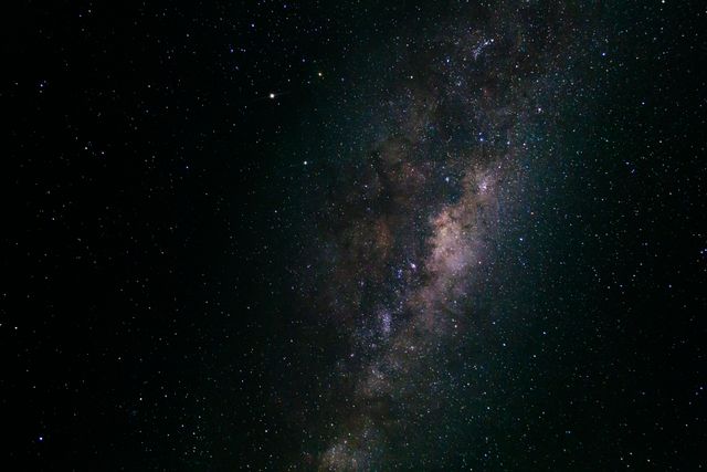 Capturing the expansive Milky Way galaxy with numerous bright stars speckling the night sky, perfect for projects related to astronomy, space exploration, and stargazing events. Useful for magazines, blogs, educational materials, and posters representing cosmic phenomena and the beauty of our universe.
