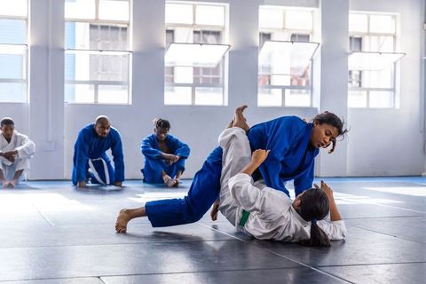 Professional Female Grapplers Practicing Intense BJJ Moves