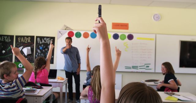 Students Raising Hands in Classroom with Teacher Leading Lesson - Download Free Stock Images Pikwizard.com