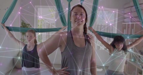 Aerial Yoga Class and Glowing Digital Network Connection