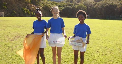Girls Recycling Outdoors Enhancing Environmental Awareness at School
