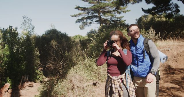 Smiling couple hiking in forest, young adults enjoying nature - Download Free Stock Images Pikwizard.com