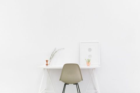 Minimalist workspace with white decor on desk