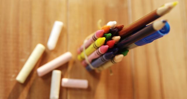 Close-Up of Colorful Crayons and Chalk on Wooden Surface - Download Free Stock Images Pikwizard.com