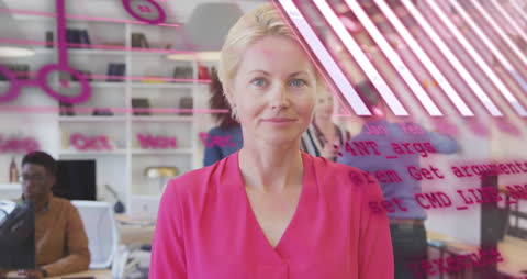 Smiling Businesswoman Superimposed with Digital Code