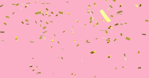 Golden Confetti Falling Against Pastel Pink Sky