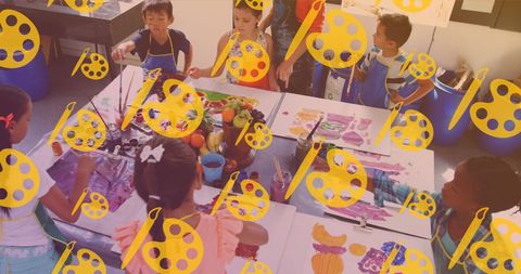 Diverse schoolchildren engaged in creative painting activity