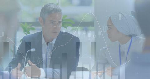 Diverse Business Team Analyzing Data in Meeting