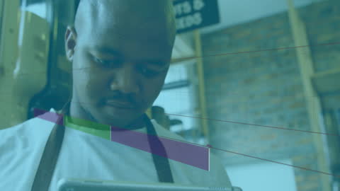 Warehouse Worker Analyzing Data with Graph Overlay