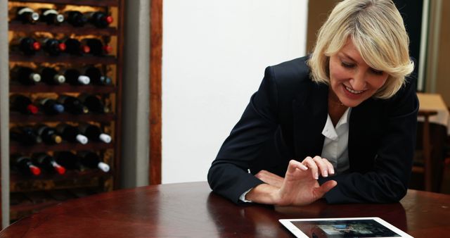 Businesswoman Using Digital Tablet at Wine Cellar - Download Free Stock Images Pikwizard.com