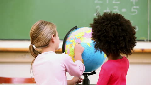 Diverse Children Exploring Globe in Classroom