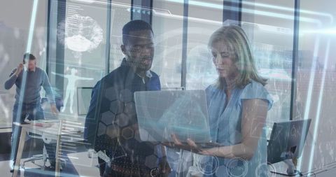 tech professionals collaborating in modern office with futuristic interface - Download Free Stock Images Pikwizard.com