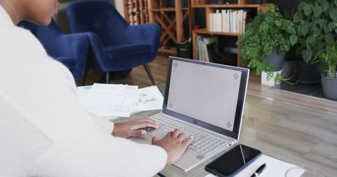 African American Woman Working on Laptop in Modern Home Setting - Download Free Stock Images Pikwizard.com