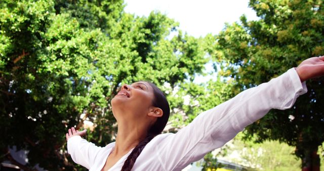 Joyful Woman Embracing Nature Outdoors with Arms Wide Open - Download Free Stock Images Pikwizard.com