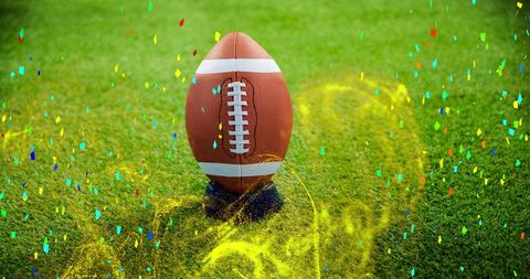 Celebratory Rugby Ball on Field with Festive Confetti - Download Free Stock Images Pikwizard.com