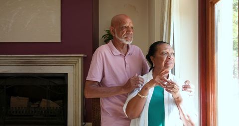 Senior African American Couple Planning in Cozy Living Room