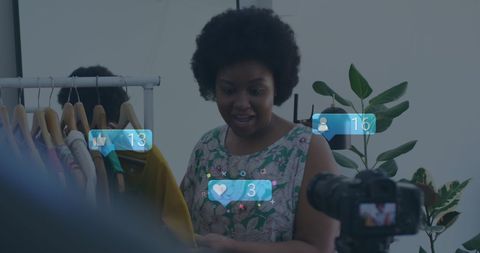 Fashion influencer live streaming in clothing store