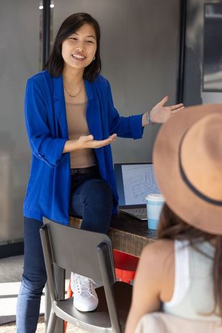 Young Female Professional Presenting Design in Modern Office