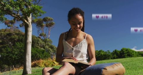 Woman Relaxing on Sunny Hill Reading Book