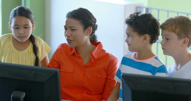 Teacher Instructing Diverse Group of Students on Computers - Download Free Stock Photos Pikwizard.com